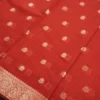 Red silk cotton saree with golden zari buttas and sage grey pallu and blouse
