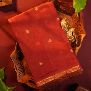 Red silk cotton saree with golden zari buttas, golden border and navy blue pallu