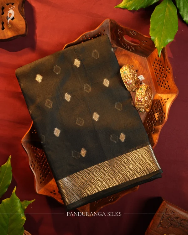 Black Soft Silk Cotton Saree with Golden Zari Buttas and Border Black silk cotton saree with golden zari buttas and geometric zari border