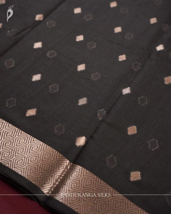 Black Soft Silk Cotton Saree with Golden Zari Buttas and Border Black silk cotton saree with golden zari buttas and geometric zari border