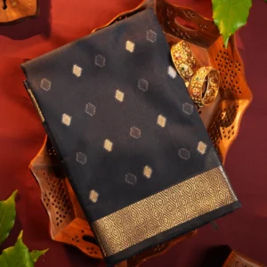 Dark grey silk cotton saree with golden zari buttas and geometric zari border