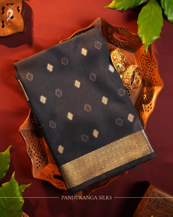 Dark Grey Soft Silk Cotton Saree with Golden Zari Buttas Design Dark grey silk cotton saree with golden zari buttas and geometric zari border