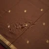 Brown Soft Silk Cotton Saree with Golden Zari Buttas and Purple Pallu Brown silk cotton saree with golden zari buttas and a purple pallu with zari border