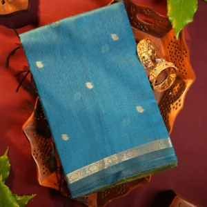 Blue silk cotton saree with golden zari buttas and leaf green pallu