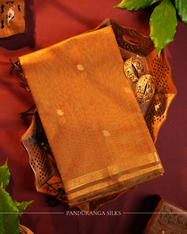 Mustard Gold Soft Silk Cotton Saree with Golden Zari Buttas Design Mustard gold silk cotton saree with golden zari buttas and detailed golden border
