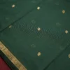 Dark Green Soft Silk Cotton Saree with Golden Zari Buttas Design Dark green silk cotton saree with golden zari buttas and detailed zari border