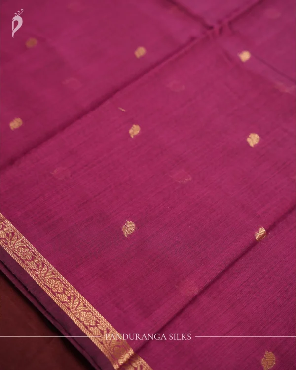 Rani Purple Soft Silk Cotton Saree with Golden Zari Buttas Design Rani purple silk cotton saree with golden zari buttas and brown zari border