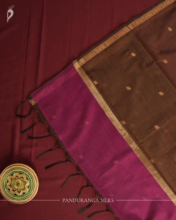 Rani Purple Soft Silk Cotton Saree with Golden Zari Buttas Design Rani purple silk cotton saree with golden zari buttas and brown zari border