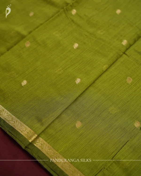 Leaf Green Soft Silk Cotton Saree with Golden Zari Buttas Design Leaf green silk cotton saree with golden zari buttas and golden zari border