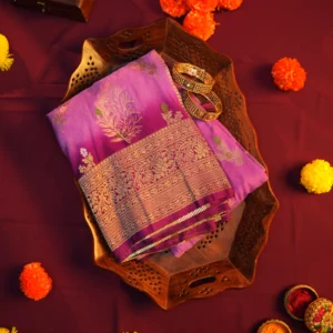 Pistachio and bottle green georgette silk saree with floral zari buttas, golden zari border and tassel pallu
