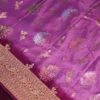 Pistachio and bottle green georgette silk saree with floral zari buttas, golden zari border and tassel pallu