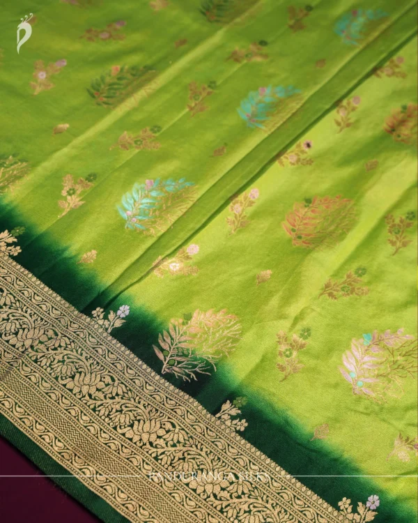 Green Georgette Silk Saree with Floral Buttas and Golden Zari Border Green georgette silk saree with floral zari buttas, golden zari border, floral motifs and tassel pallu
