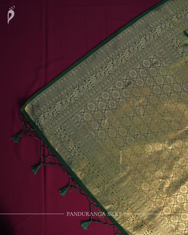 Green Georgette Silk Saree with Floral Buttas and Golden Zari Border Green georgette silk saree with floral zari buttas, golden zari border, floral motifs and tassel pallu