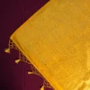 Lemon yellow georgette silk saree with floral zari buttas, golden zari border, floral motifs and tassel pallu