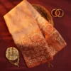 Blush peach Tussar silk saree with embossed geometric design and terracotta floral border