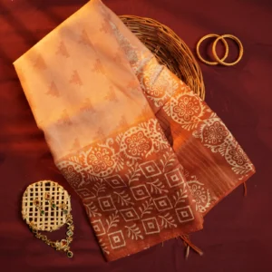 Blush peach Tussar silk saree with embossed geometric design and terracotta floral border