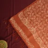 Blush Peach Tussar Silk Saree with Embossed Geometric Design Blush peach Tussar silk saree with embossed geometric design and terracotta floral border