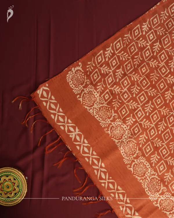 Blush Peach Tussar Silk Saree with Embossed Geometric Design Blush peach Tussar silk saree with embossed geometric design and terracotta floral border