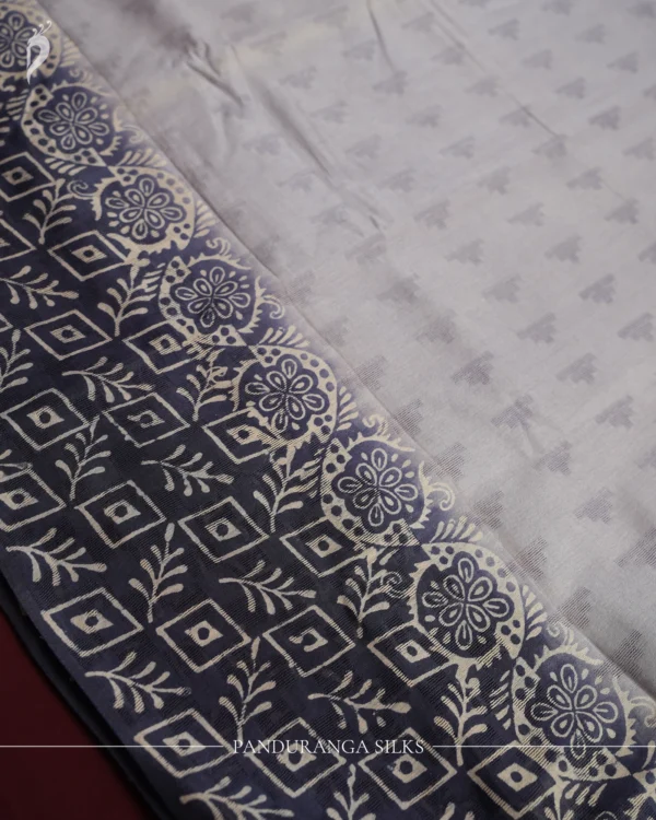 Navy Blue Tussar Silk Saree with Embossed Geometric Design Work Navy blue Tussar silk saree with embossed geometric design and floral geometric border