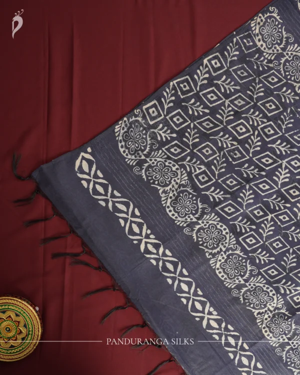 Navy Blue Tussar Silk Saree with Embossed Geometric Design Work Navy blue Tussar silk saree with embossed geometric design and floral geometric border